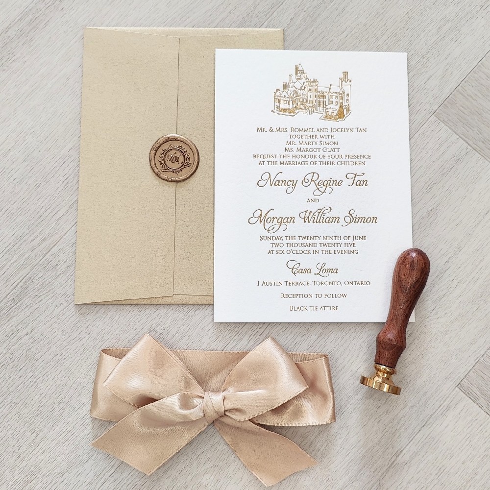 This is a vintage and timeless letterpress wedding invitation printed with gold ink on a white cotton 450 GSM paper.  There is a champagne gold satin ribbon bow that can be tied around the invitation.  On the main layout, there is an outline venue sketch of the reception location.  This wedding invite is paired with a gold envelope.
This wedding took place at the historic Casa Loma in Toronto, Ontario, Canada.
If you’ve always dreamed of a storybook wedding, Casa Loma is one of Toronto’s most magical venues. This historic castle, built in 1914, offers a breathtaking blend of elegance and romance right in the heart of the city. From its grand stone exterior to its lush gardens overlooking the skyline, every corner of Casa Loma provides an unforgettable backdrop for your wedding day.
Couples can exchange vows in the charming outdoor gardens or inside the stunning Conservatory, with its marble floors and glowing stained-glass dome. Receptions are often held in the Great Hall or the Library — both featuring soaring ceilings, intricate details, and timeless character. Casa Loma is managed by Liberty Entertainment Group, known for its exceptional catering and seamless event coordination.
At Stephita Wedding Invitations, we’ve had the pleasure of designing custom invitation suites for many couples celebrating at Casa Loma. The castle’s romantic and vintage-inspired aesthetic pairs beautifully with our luxurious letterpress and foil-pressed invitations, vellum wraps, and wax seal embellishments. Whether you’re planning a grand black-tie evening or an intimate garden ceremony, we can help you create stationery that perfectly complements the elegance of Casa Loma. This is a vintage and timeless letterpress wedding invitation printed with gold ink on a white cotton 450 GSM paper.  There is a champagne gold satin ribbon bow that can be tied around the invitation.  On the main layout, there is an outline venue sketch of the reception location.  This wedding invite is paired with a gold envelope.
This wedding took place at the historic Casa Loma in Toronto, Ontario, Canada.
If you’ve always dreamed of a storybook wedding, Casa Loma is one of Toronto’s most magical venues. This historic castle, built in 1914, offers a breathtaking blend of elegance and romance right in the heart of the city. From its grand stone exterior to its lush gardens overlooking the skyline, every corner of Casa Loma provides an unforgettable backdrop for your wedding day.
Couples can exchange vows in the charming outdoor gardens or inside the stunning Conservatory, with its marble floors and glowing stained-glass dome. Receptions are often held in the Great Hall or the Library — both featuring soaring ceilings, intricate details, and timeless character. Casa Loma is managed by Liberty Entertainment Group, known for its exceptional catering and seamless event coordination.
At Stephita Wedding Invitations, we’ve had the pleasure of designing custom invitation suites for many couples celebrating at Casa Loma. The castle’s romantic and vintage-inspired aesthetic pairs beautifully with our luxurious letterpress and foil-pressed invitations, vellum wraps, and wax seal embellishments. Whether you’re planning a grand black-tie evening or an intimate garden ceremony, we can help you create stationery that perfectly complements the elegance of Casa Loma.