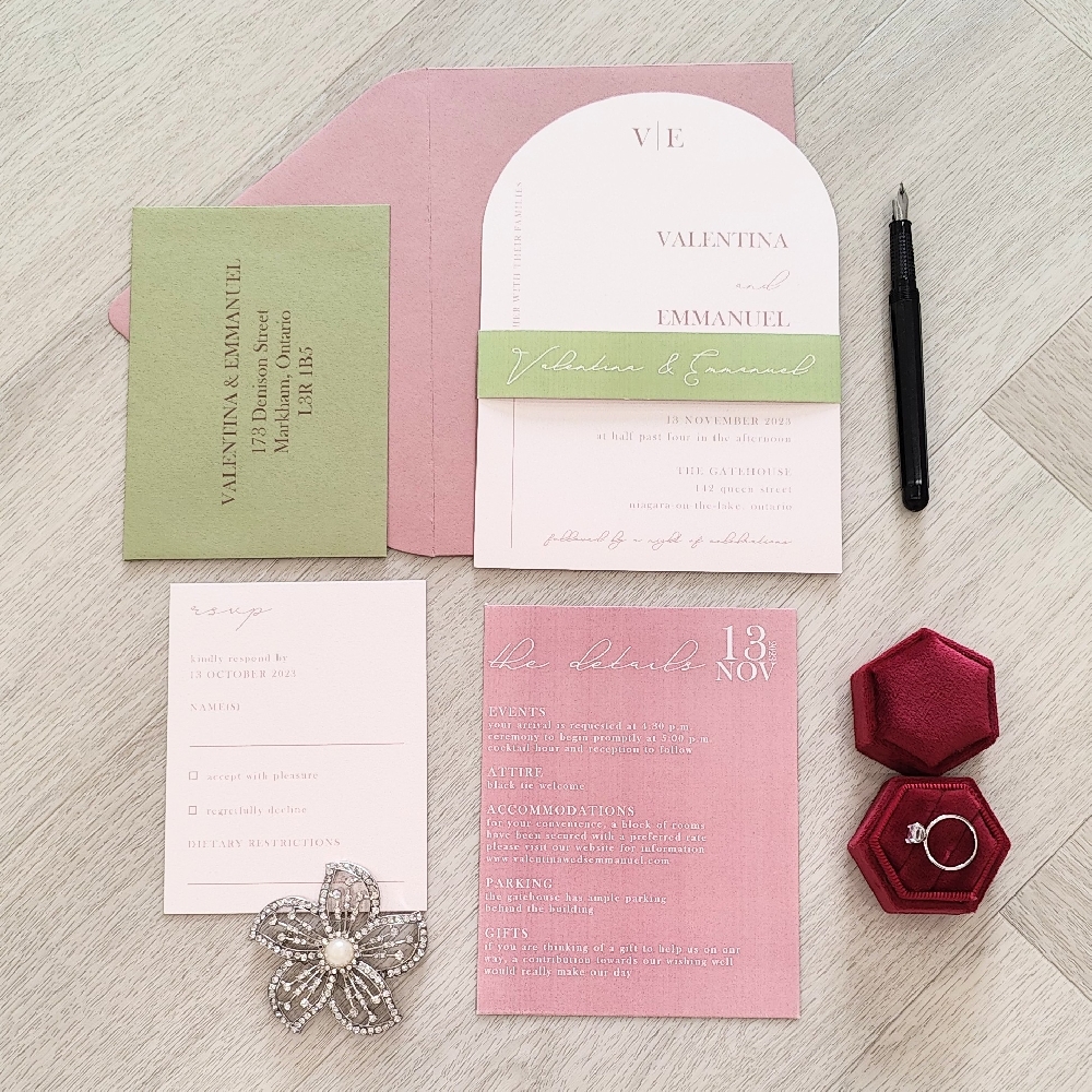 This is an arch shape wedding invite with multiple inserts and a belly band.  It is paired with a rose nude envelope.