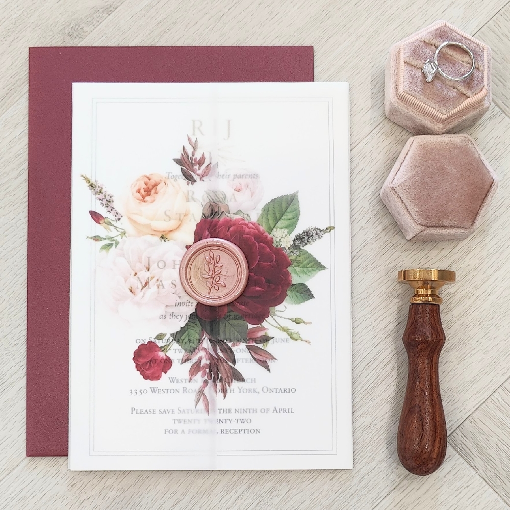 Simple single card wedding invite with an elegant vellum wrap and wax seal touch.