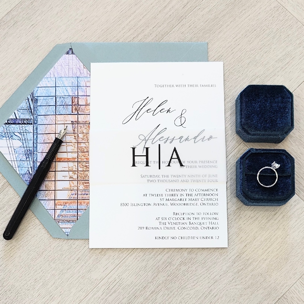 Single card wedding invite with a vellum belly band.  Paired with a blue envelope and venue design liner.