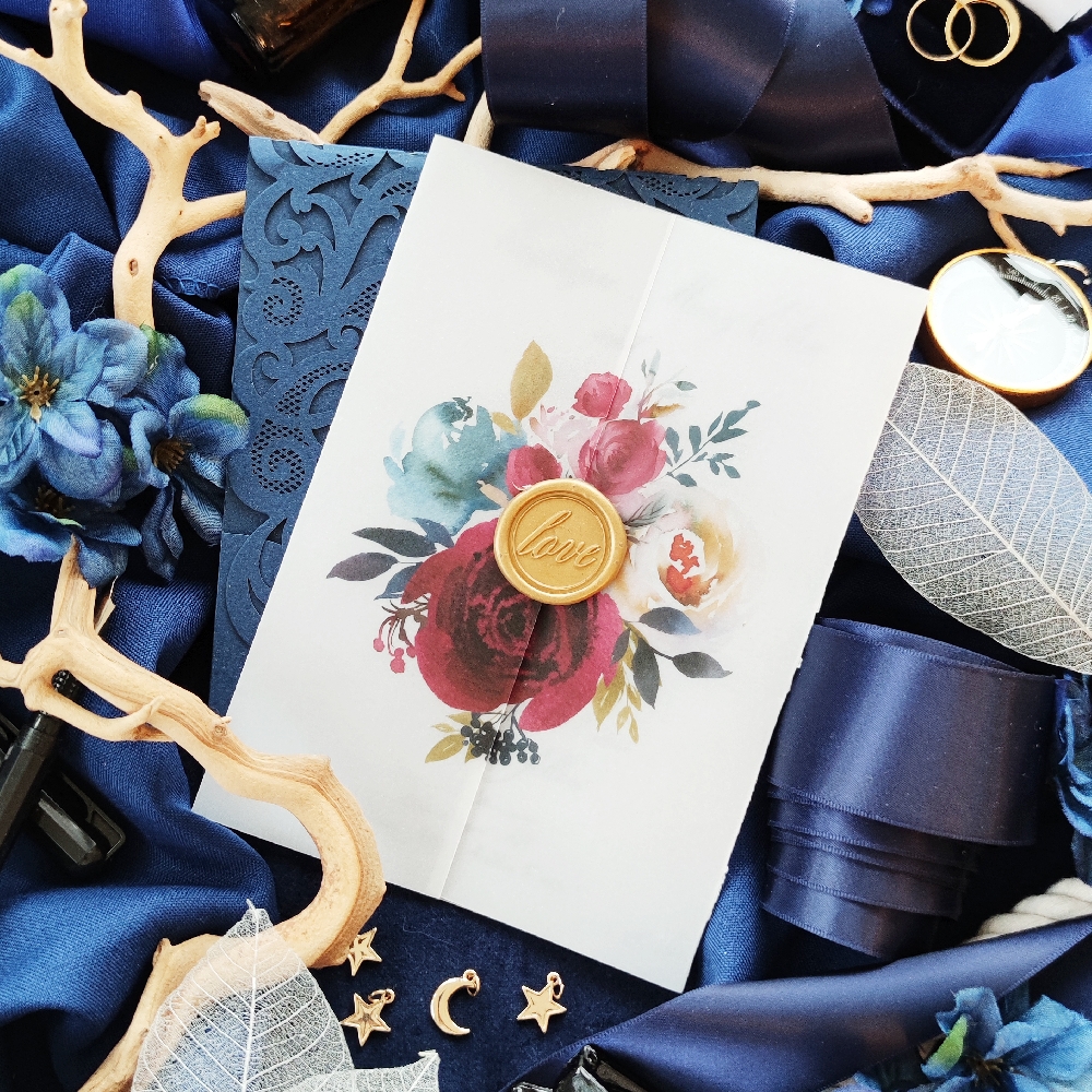 We offer a variety of opaque vellum wraps with a wax seal, tag or ribbon embellishments. We can also create a custom one for your own perfect wedding invitation.