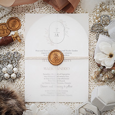 Invitation 3605: Ice Pearl, Gold Wax, String Ribbon - White Arched shaped wedding card with blank vellum wrap, string and gold wax seal.