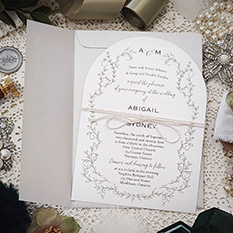 Invitation 3608: Matte White, String Ribbon - Matte white arch shaped wedding card with a string tied as a bow.