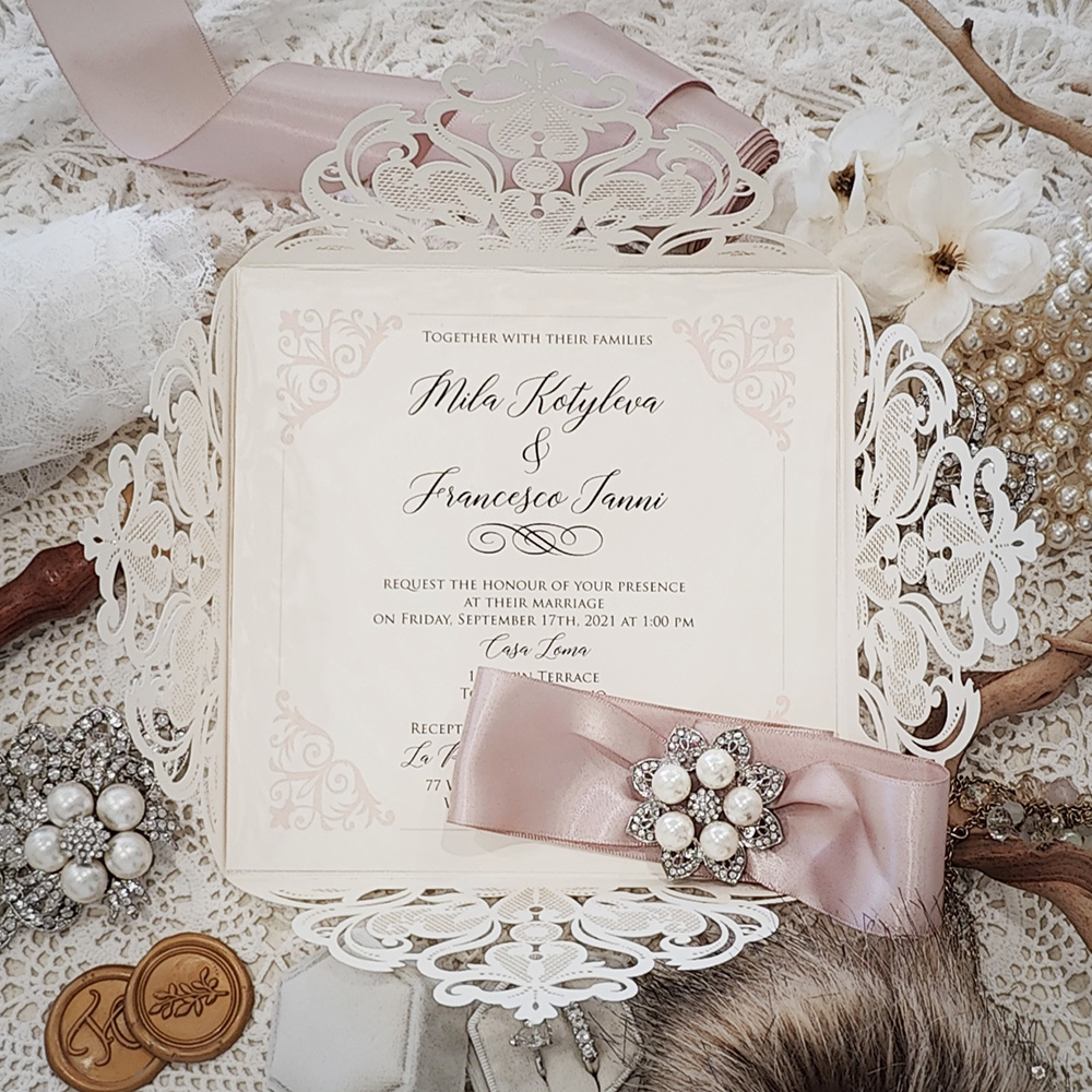 Invitation 3504: Ivory Shimmer, Cream Smooth, Deep Blush Ribbon, Brooch/Buckle T - This is a laser cut 4 flap wedding design with a ribbon and brooch detail.