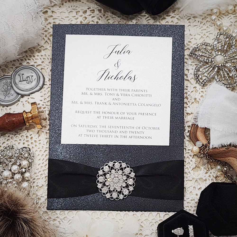 Invitation 3507: Black Pearl, White Smooth, Black Ribbon, Brooch/Buckle X - Black pocket style invite with a black ribbon and rhinestone brooch.