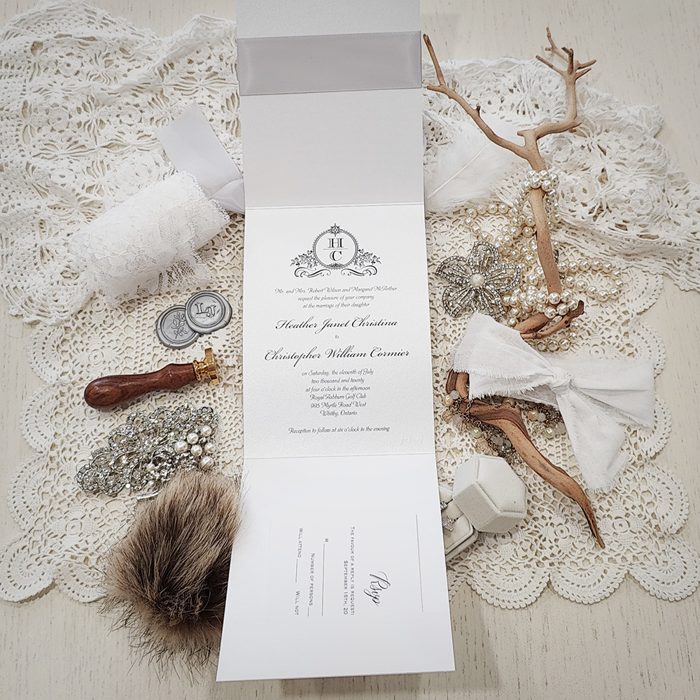 Invitation 3510: Ice Pearl, Silver Ribbon, Brooch/Buckle G - Pocketfolder on ice pearl paper with a silver ribbon and pearl brooch.