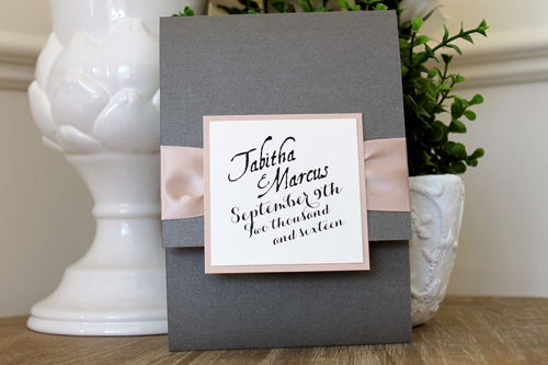 Invitation 1508: Charcoal Pearl, Blush Pearl, Cream Smooth, Deep Blush Ribbon - This three fold invite opens with a pocket at the bottom.  The ribbon is pinched with a large tag in the centre.