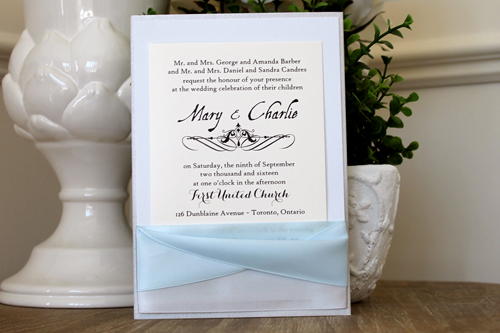 Invitation 1509: Silver Ore, Dust Blue, Cream Smooth, Silver Ribbon, Icy Blue Ribbon - This invitation card sits vertically inside a pocket created with silver and light blue ribbons.