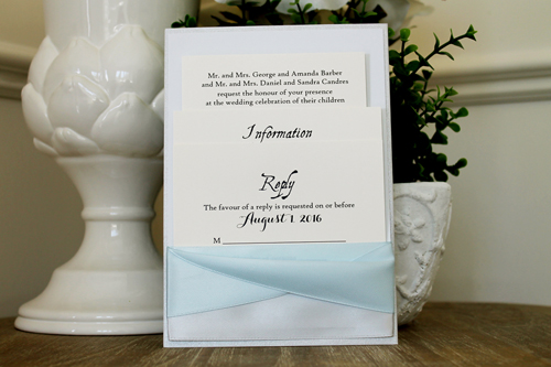 Invitation 1509: Silver Ore, Dust Blue, Cream Smooth, Silver Ribbon, Icy Blue Ribbon - This invitation card sits vertically inside a pocket created with silver and light blue ribbons.