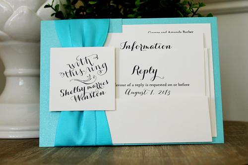 Invitation 1516: Tiffany Pearl, Cream Smooth, Turquoise Ribbon, Turquoise Ribbon - This invite is layered with two thick ribbons along the side and a tag over the ribbons.