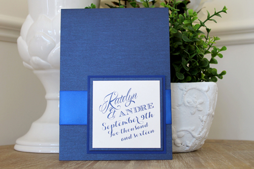 Invitation 1522: Navy Pearl, Marine Blue, Cream Smooth, Royal Blue Ribbon - This 5x7 pocktfold invite opens to be very long with the invite wording in the middle and pocket at the bottom.