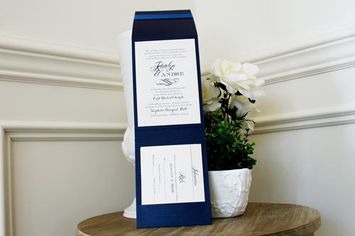 Invitation 1522: Navy Pearl, Marine Blue, Cream Smooth, Royal Blue Ribbon - This 5x7 pocktfold invite opens to be very long with the invite wording in the middle and pocket at the bottom.