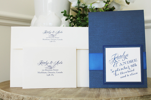 Invitation 1522: Navy Pearl, Marine Blue, Cream Smooth, Royal Blue Ribbon - This 5x7 pocktfold invite opens to be very long with the invite wording in the middle and pocket at the bottom.