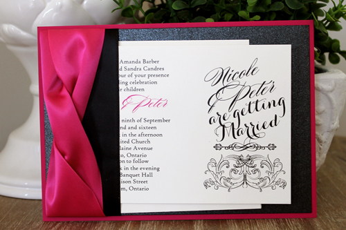 Invitation 1524: This stunning azalea and pink invite is very bold with two thick azalea ribbons twisted together and a flat black ribbon below.  The paper is also a combination of azalea and black pearl.