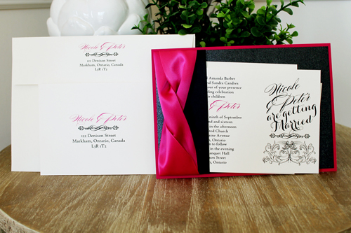 Invitation 1524: This stunning azalea and pink invite is very bold with two thick azalea ribbons twisted together and a flat black ribbon below.  The paper is also a combination of azalea and black pearl.