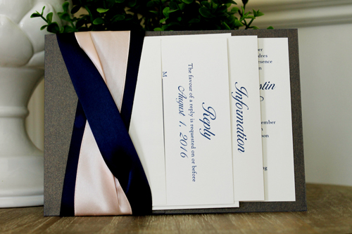 Invitation 1530: This invite incorporates a lot of ribbon detail on the card.  There are two thick navy ribbons twisted with one thick blush ribbon weaved in with the navy ribbon.