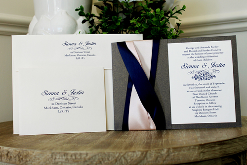 Invitation 1530: This invite incorporates a lot of ribbon detail on the card.  There are two thick navy ribbons twisted with one thick blush ribbon weaved in with the navy ribbon.