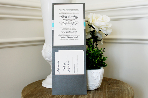 Invitation 1545: This invite card has a large cover tag that has three layers, using light blue and silver paper.  The ribbon is also a matching light silver thick ribbon with a turquoise ribbon on top.