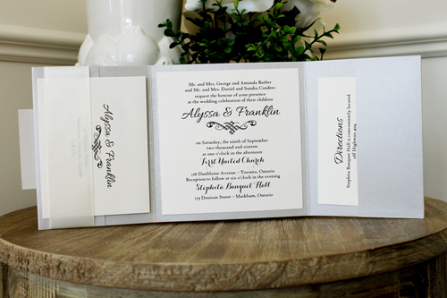 Invitation 1547: Silver Ore, Stone, Cream Smooth, Antique Ribbon - This popular square pocketfold uses silver pearl paper and an antique ribbon pinched in the middle with a square tag.