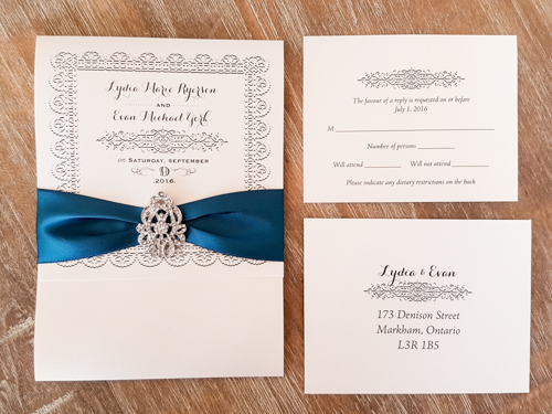 Invitation 1709: White Gold, White Gold, Teal Ribbon, Brooch/Buckle A17 - This is a 3/4 flap white gold pearl pocket folder wedding invite with a teal ribbon and brooch design.