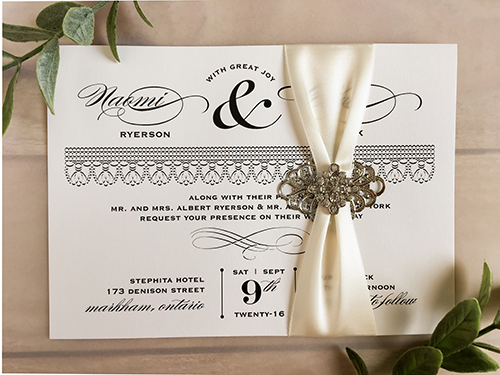 Invitation 1744: Antique Pearl, Antique Pearl, Antique Ribbon, Brooch/Buckle A22, Metal Filigree F2 - Silver - This is a single card antique pearl paper wedding invite with a ribbon and brooch design wrapped around.