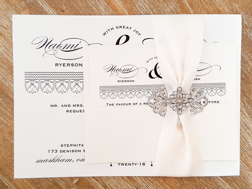 Invitation 1744: Antique Pearl, Antique Pearl, Antique Ribbon, Brooch/Buckle A22, Metal Filigree F2 - Silver - This is a single card antique pearl paper wedding invite with a ribbon and brooch design wrapped around.