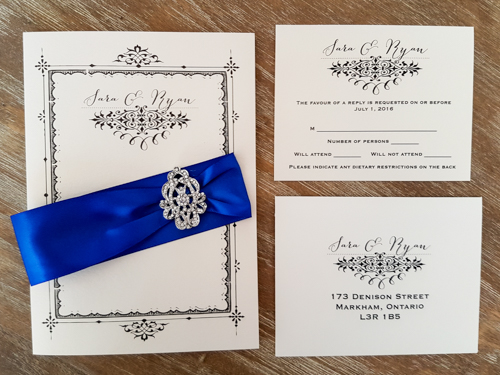 Invitation 1806: White Gold, White Gold, Royal Blue Ribbon, Brooch/Buckle A17 - This is a full cover flap pocketfolder wedding invite in white gold pearl.  There is a royal blue ribbon and brooch design.