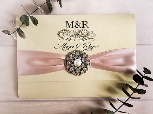 Invitation 1818: Gold Dust, Gold Dust, Deep Blush Ribbon, Brooch/Buckle A6 - This is a 3/4 cover flap pocket fold wedding invite on the gold dust paper.  There is a deep blush ribbon and brooch detail.