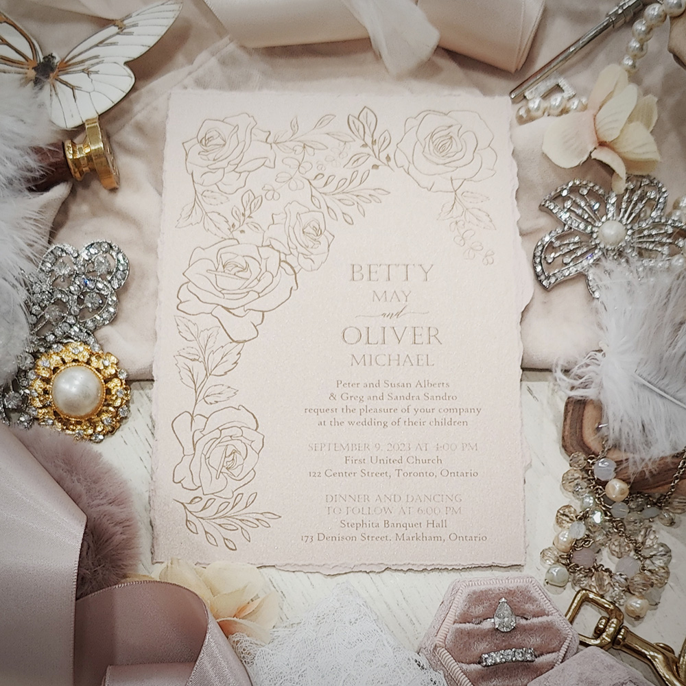 Invitation 2840: Blush Pearl - Deckled edge wedding card printed on a blush pearl paper with a gold floral design.