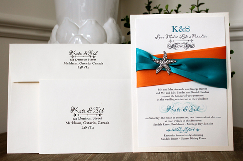 Invitation Destination10: Ivory Pearl, Cream Smooth, Orange Ribbon, Peacock Ribbon, Brooch/Buckle A10 - This is a layered invitation with a crisscross ribbon design and a rhinestone starfish brooch in the middle.