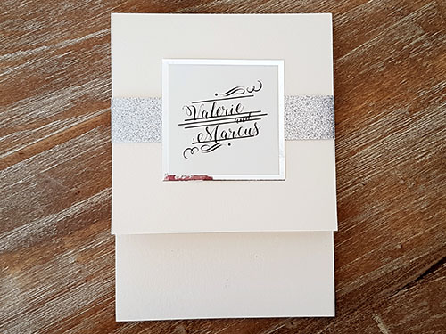 Invitation 2115: White Gold, Silver Mirror, Cream Smooth - This is a vertical pocket folder on white gold pearl paper.  There is silver glitter band and silver mirror layered cover tag.