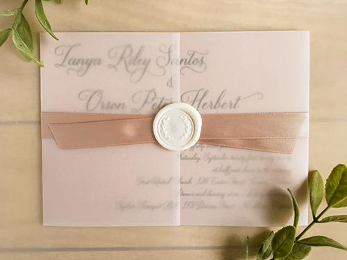 Invitation 2242: This is a single card invite in a landscape format printed on a blush pearl paper.  There is a vellum gate fold wrap with a blush ribbon and ivory wreath wax seal.