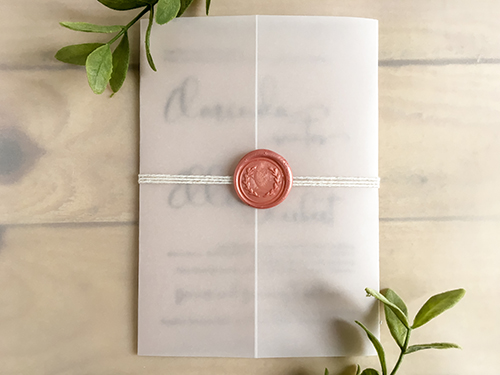 Invitation 2274: Blush Pearl, Blush Wax - This is a single card printed on blush pearl paper with a blank vellum wrap.  White string wrapped around the invite with a blush wreath wax seal.