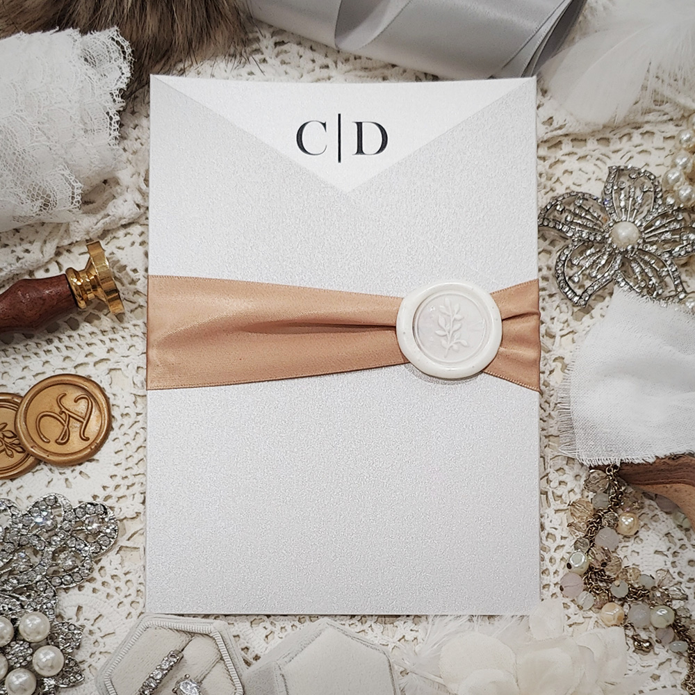 Invitation 3310: Silver Ore, Cream Smooth, Ivory Wax, Deep Blush Ribbon - Silver Ore slanted gate fold invite with a deep blush ribbon and ivory wax seal.