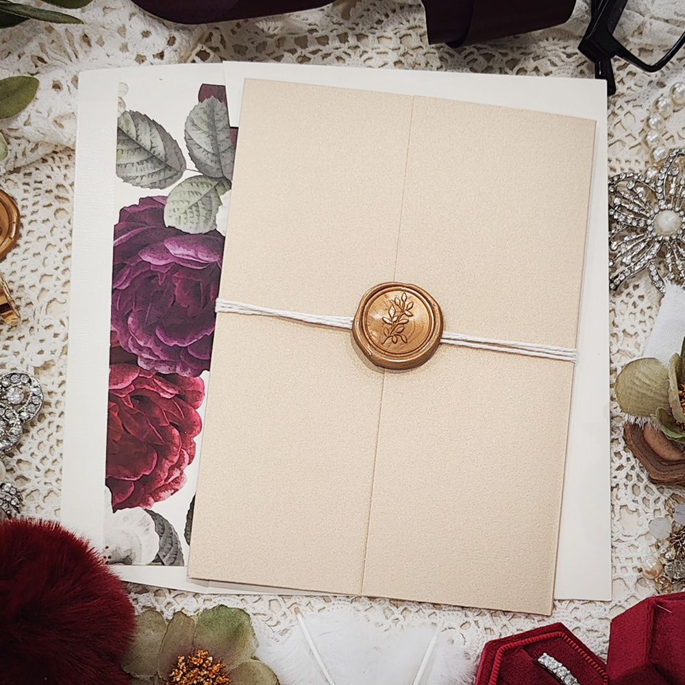 Invitation 3315: Champagne Gold, Gold Wax, String Ribbon - Gate fold wedding card with a string and gold wax seal around it.