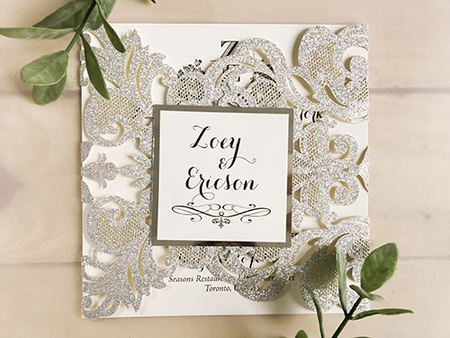 Invitation lc103: Glitter Silver, Silver Mirror, Cream Smooth - This is a silver glitter damask pattern gate fold laser cut wedding invite.  There is a silver mirror layered cover tag.