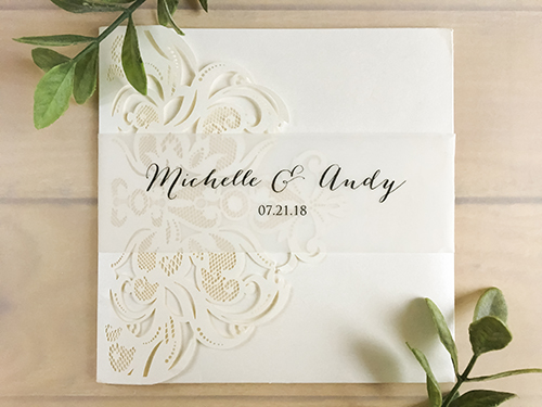 Invitation lc107: Ivory Shimmer, Cream Smooth - This is a ivory shimmer laser cut pocket folder wedding invite.  There is a printed vellum belly band.