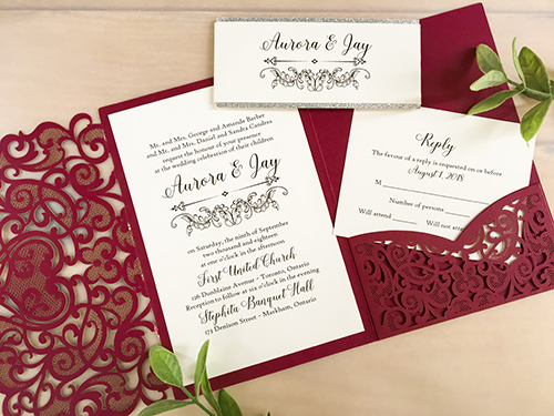 Invitation lc118: Burgundy Shimmer, Silver Glitter, Cream Smooth - This is a burgundy shimmer laser cut wedding invitation.  There is a silver glitter layered belly band wrapped around the card.