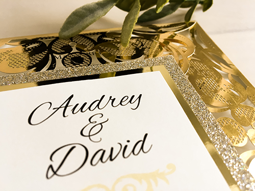 Invitation lc122: Mirror Gold, Gold Mirror, Cream Smooth - This is a four flap gold mirror laser cut wedding invite.  There is a double layered cover tag in champagne glitter and gold mirror.