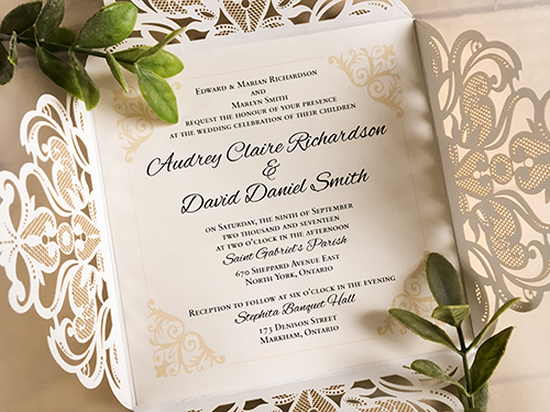 Invitation lc122: Mirror Gold, Gold Mirror, Cream Smooth - This is a four flap gold mirror laser cut wedding invite.  There is a double layered cover tag in champagne glitter and gold mirror.