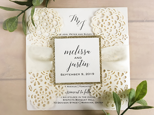 Invitation lc124: Ivory Shimmer, Champagne Glitter, Cream Smooth, Antique Ribbon - This is an ivory shimmer gate fold laser cut wedding design.  There is an antique ribbon with a champagne glitter layered cover tag.