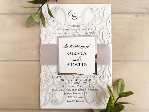 Invitation lc127: White Shimmer, Silver Mirror, White Smooth, Silver Ribbon - This is a white shimmer laser cut wedding invite design.  It is a gate fold with a intricate pattern.  There is a silver ribbon and cover tag.