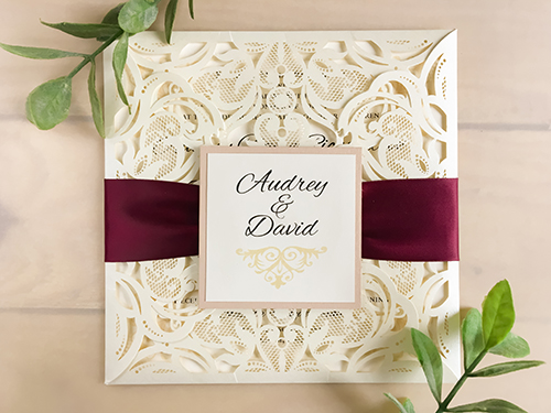 Invitation lc12: Ivory Shimmer, Blush Pearl, Cream Smooth, Wine Ribbon - Square 4 flap, laser cut wedding invitation featuring a ruched ribbon and a cover tag.