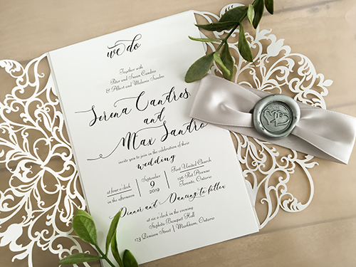 Invitation lc133: White Shimmer, White Smooth, Silver Wax, Silver Ribbon - This is a white shimmer gate fold laser cut wedding invite.  There is a silver ribbon and silver wax seal look.