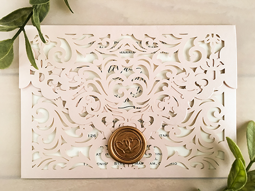 Invitation lc143: Blush Shimmer, Cream Smooth, Gold Wax - This is a blush shimmer color pocket laser cut invite.  There is a gold double heart wax seal on the flap.