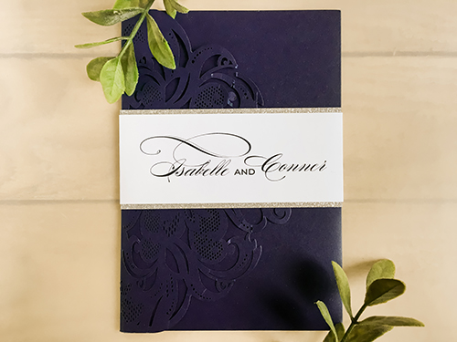 Invitation lc145: Glittering Navy, White Smooth - This is a glittering navy color pocket folder style laser cut invitation.  There is a silver glitter belly band wrapped around.