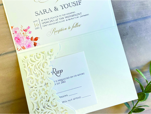 Invitation lc152: Ivory Shimmer, Cream Smooth, Blush Wax - This is an ivory shimmer pocket folder style laser cut wedding invitation.  There is a blush wax seal design on the flap.