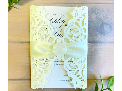 Invitation lc153: Ivory Shimmer, Ivory Wax, Antique Ribbon - This is an ivory shimmer laser cut gate fold design.  There is a ribbon and wax seal embellishment around the card.