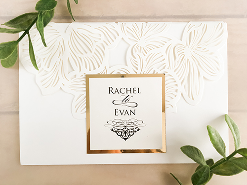 Invitation lc15: White, Gold Mirror, Cream Smooth - Orchid and floral laser cut, trifold invitation. Embellished with a gold mirror cover tag.