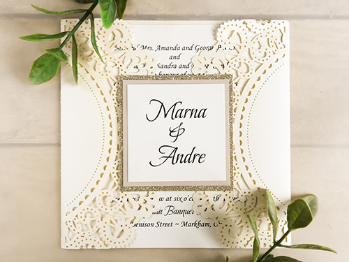 Invitation lc19: Ivory Shimmer, Blush Pearl, Cream Smooth - This is an ivory shimmer laser cut gate fold wedding invite.  The cover tag uses the blush pearl and champagne glitter papers as backings.
